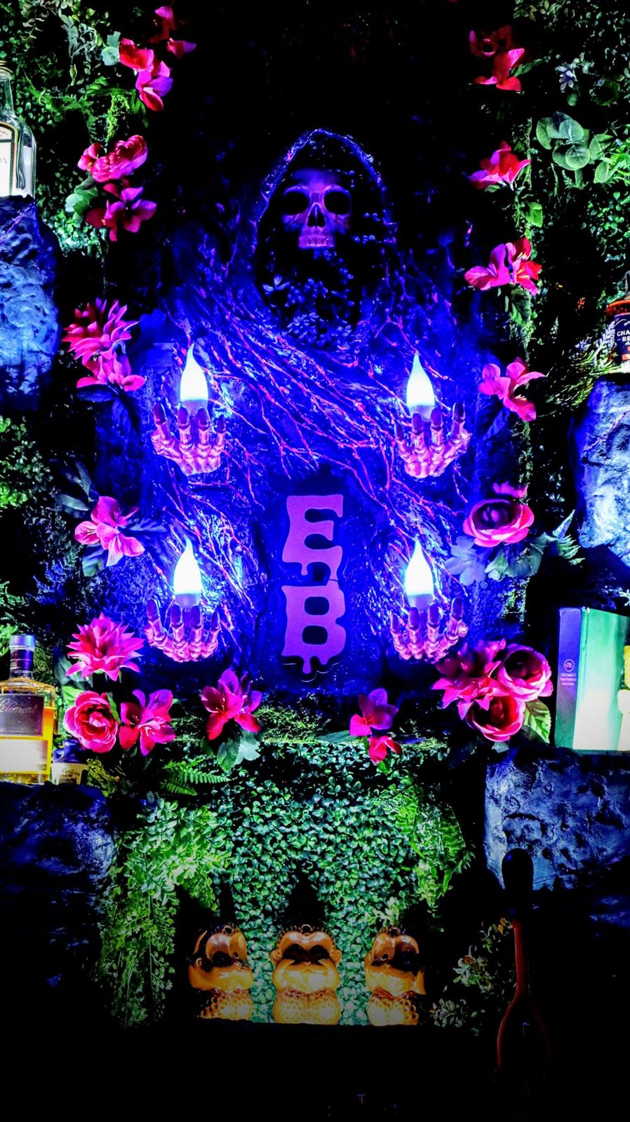 The Endless Bummer logo wall under blacklight