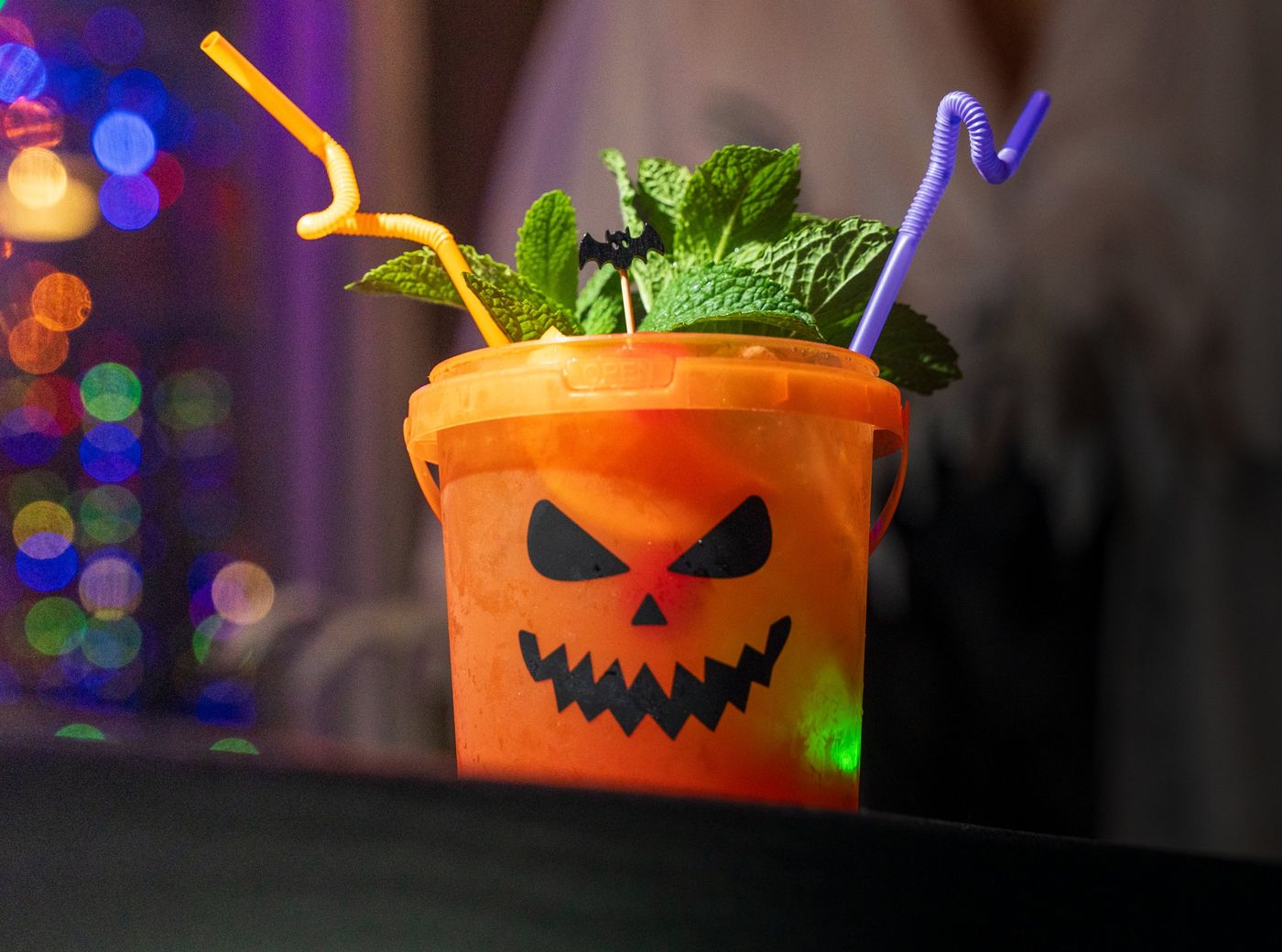 Missionary Positions of the Damned in a jack-o'-lantern bucket